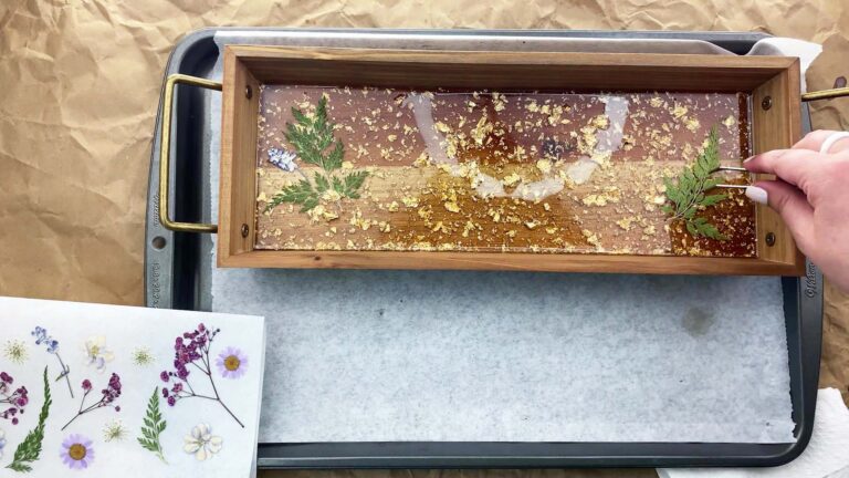 Wooden tray with dried flowers in resin