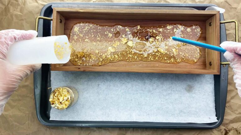 Wooden tray with gold flakes in resin